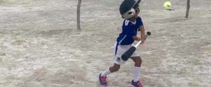 A Projects Abroad volunteer teaches a boy to play baseball and gains sports coaching work experience in Belize A young boy learns to play baseball during our volunteer sports coaching in schools in Belize